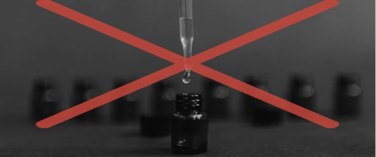 Black-and-white photo of herbal drops, crossed out in red