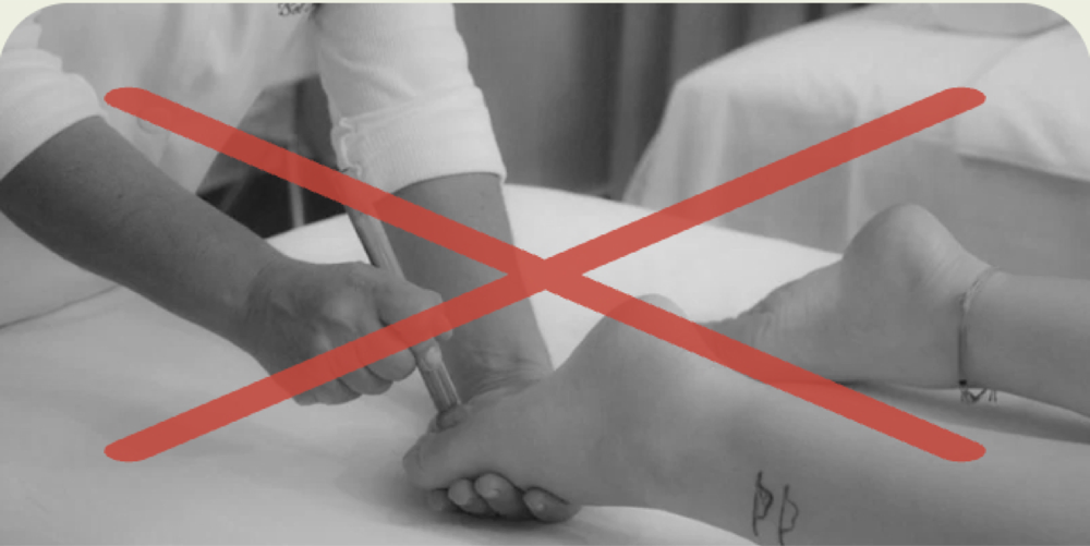 Black-and-white photo of lymphatic massage, crossed out in red